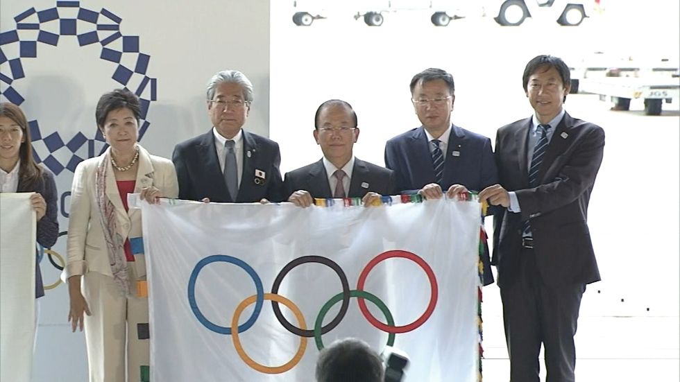 Olympic flag touches down in Tokyo