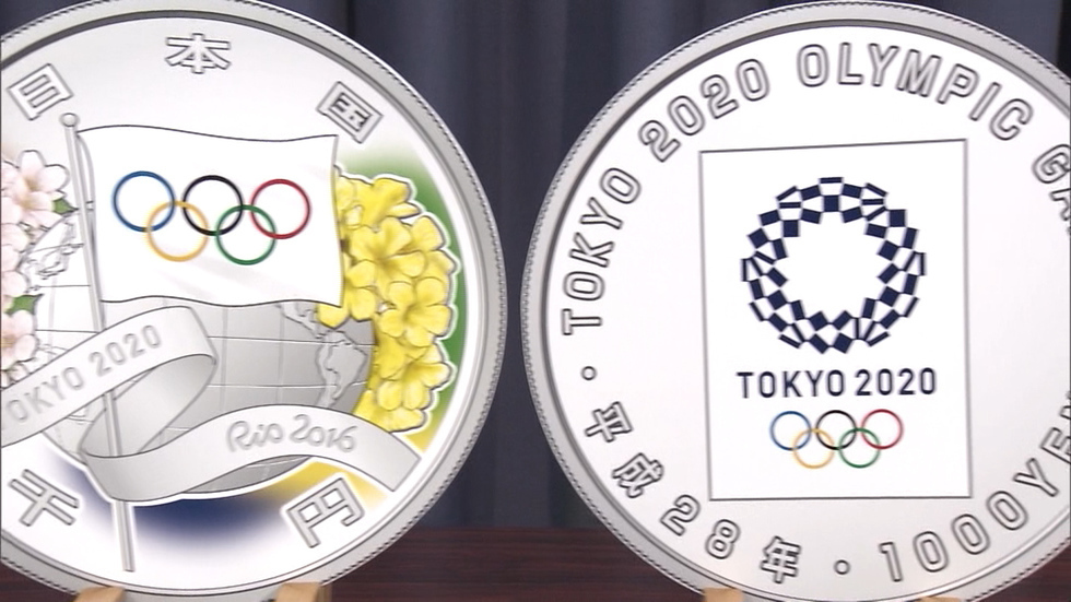 Government shows Olympic handover coin designs
