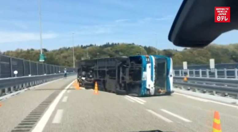 Police bus flips returning from quake-hit Kyushu 