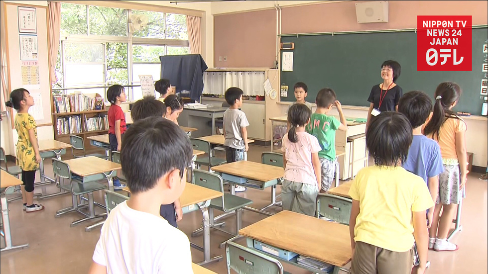 Schools reopen in rain-ravaged western Japan