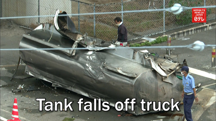 Tank falls off truck in western Japan