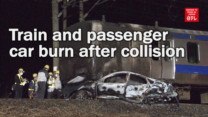 Train collides with passenger car and both vehicles burn