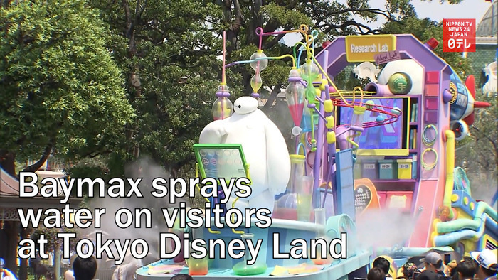 Baymax sprays cold water on visitors at Tokyo Disney Land