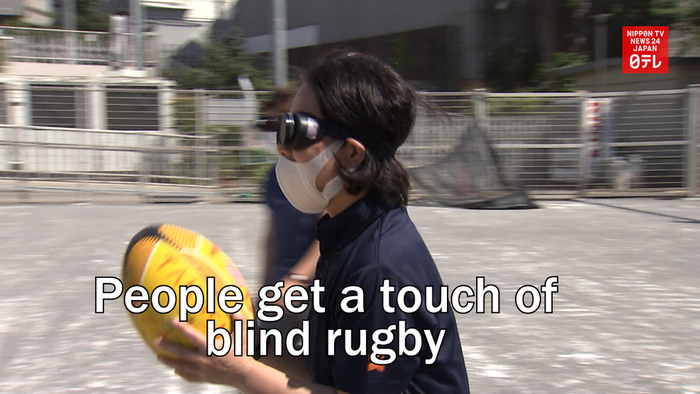 People get a touch of blind rugby in Tokyo 