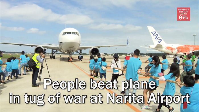 People beat plane in tug of war at Narita Airport