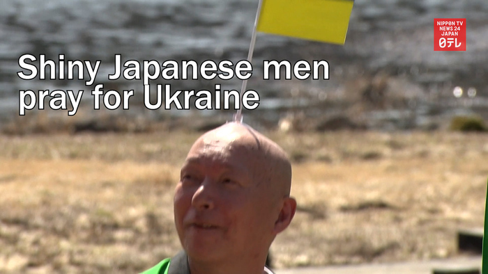 Shiny Japanese men pray for Ukraine