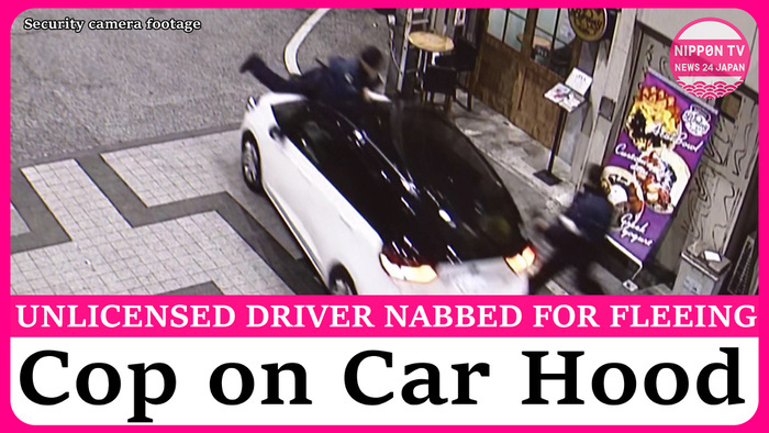 Unlicensed driver arrested after fleeing with police officer on car hood in Osaka