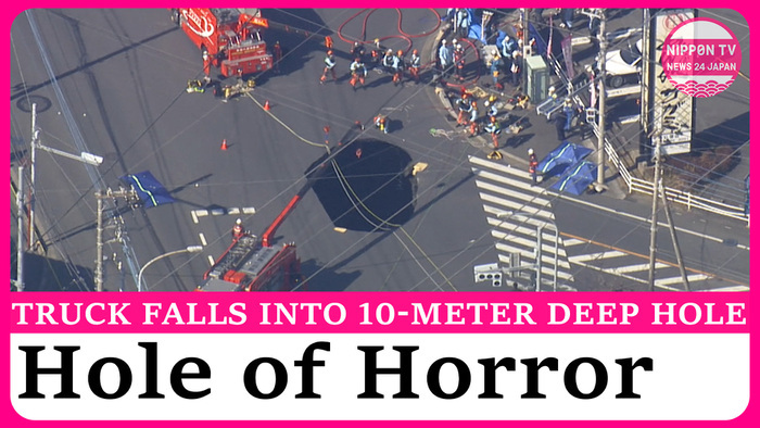 Rescue efforts continue after truck falls into massive sinkhole