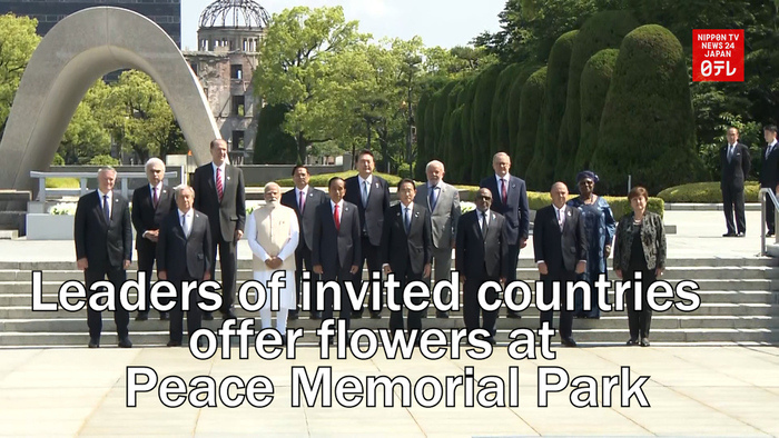 Leaders of invited countries to the G7 offer flowers at Hiroshima Peace Memorial Park