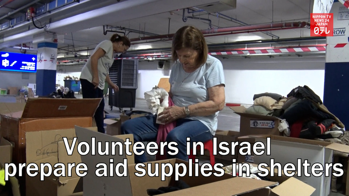 Volunteers in Israel hastily prepare aid supplies in shelters