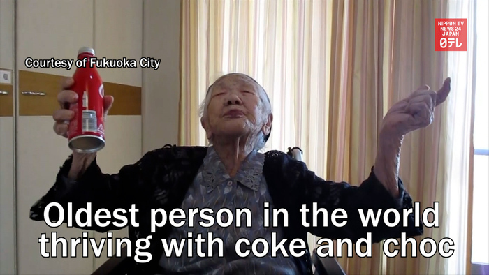 Oldest person in the world thriving with coke and choc