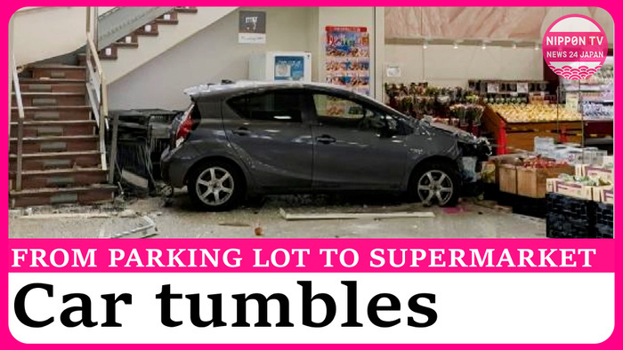 Car falls downstairs into supermarket from rooftop parking lot