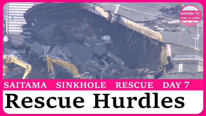  Rescue of truck driver trapped in sinkhole paused as workers face hurdles