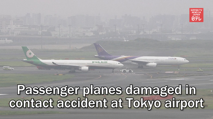 Passenger planes damaged in contact accident at Tokyo airport