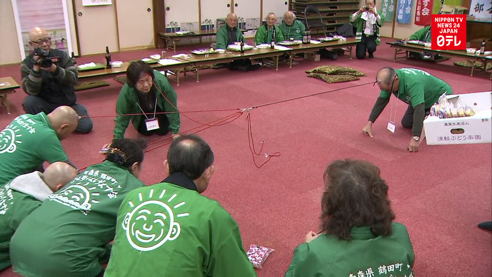 Bald men compete in tug-of-war