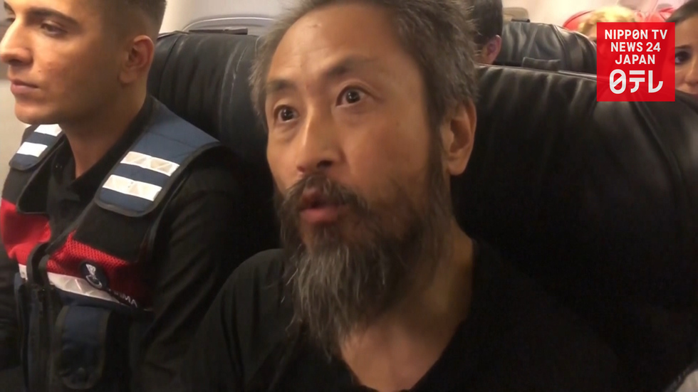 Freed journalist Junpei Yasuda returns to Japan