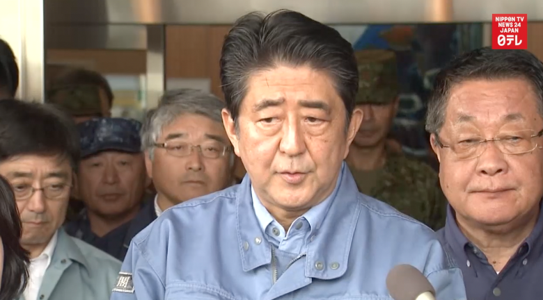 Abe tours typhoon-devastated Hokkaido