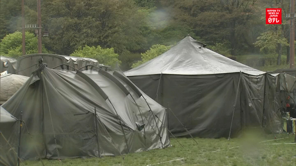 Rain disrupts search for quake victims