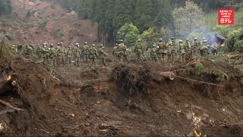 Frantic hunt for landslide survivors