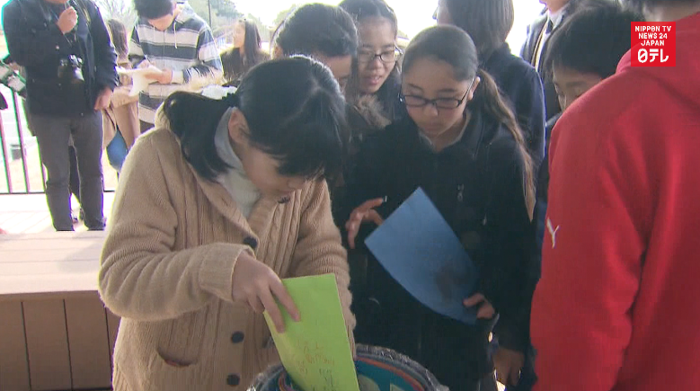 Kids bury tsunami time capsule