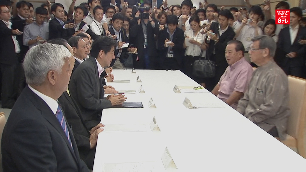 Abe accepts settlement in Henoko cases
