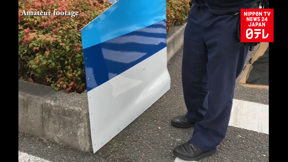 Falling plane part shatters car window