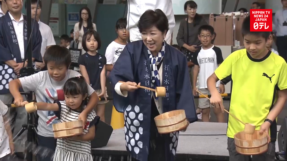 Tokyo Governor promotes traditional practice of sprinkling water
