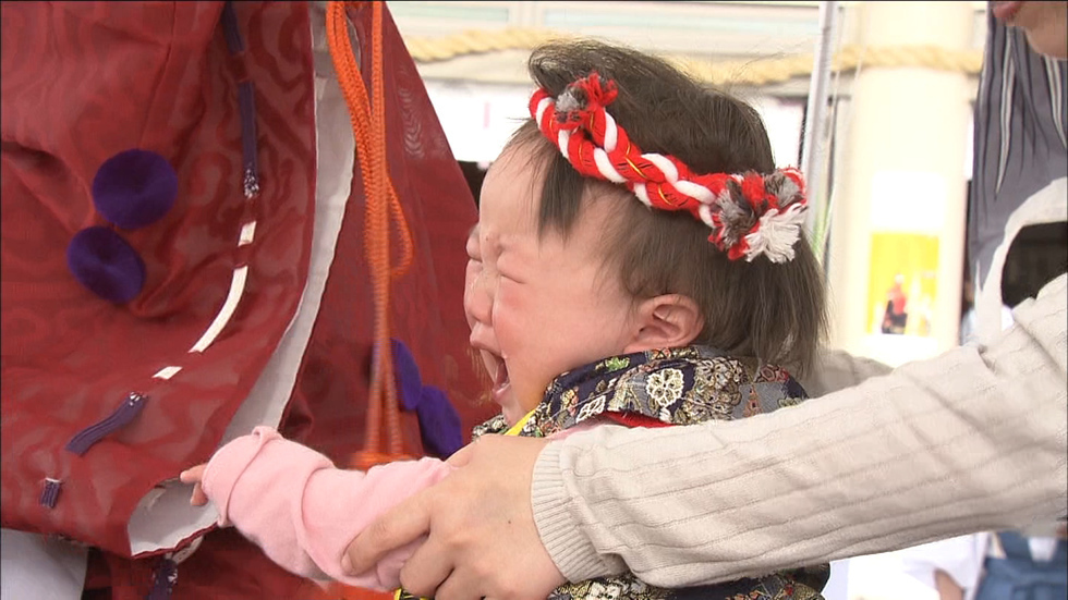 Crying babies chase away bad luck