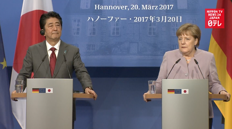 Abe, Merkel stress free trade 