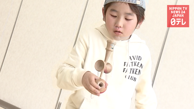 Kendama kid is just starting out  