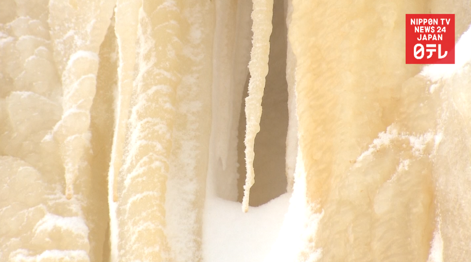 Yellow waterfall luring visitors  