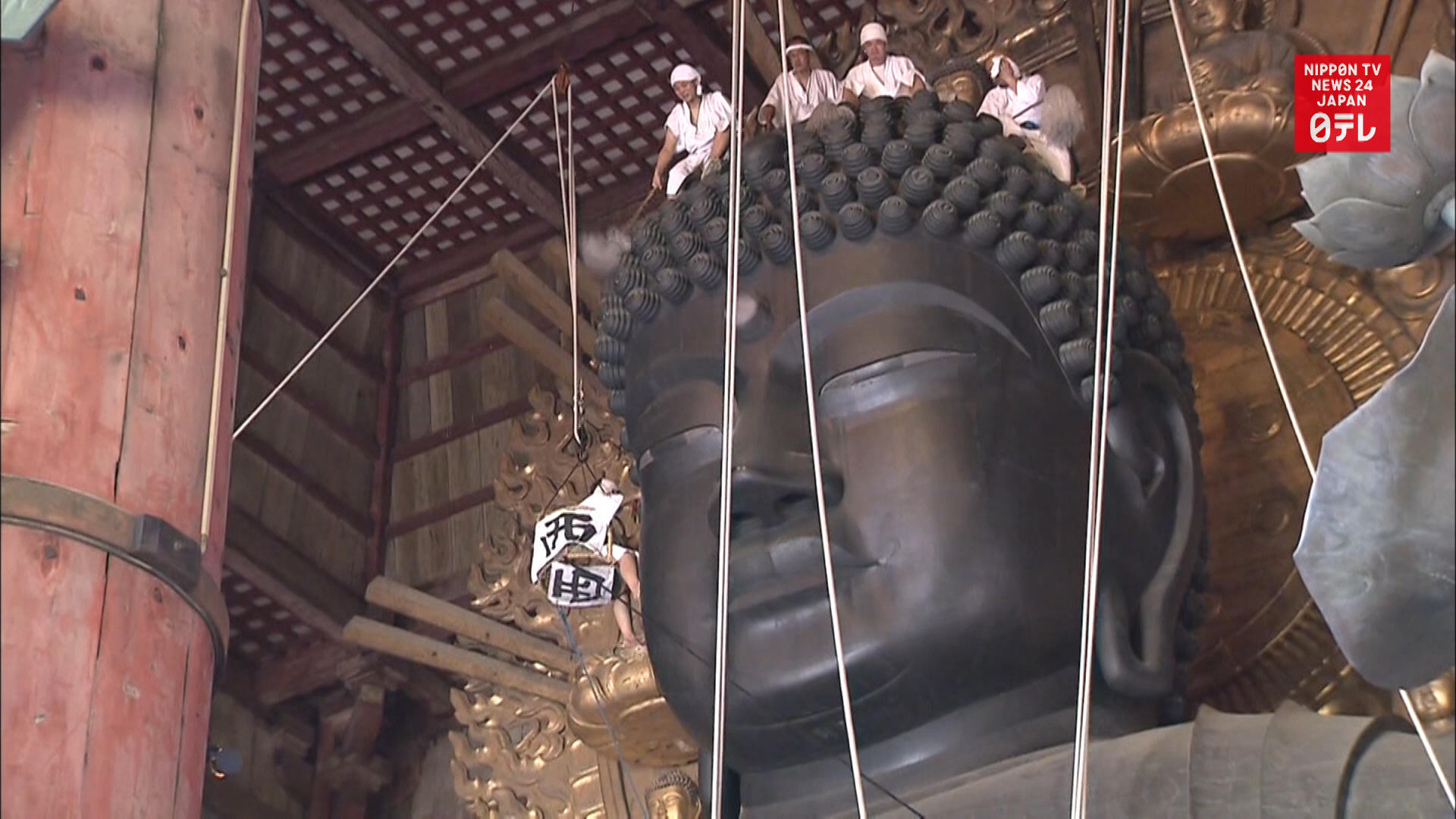 Giant Buddha cleaned before Obon holiday