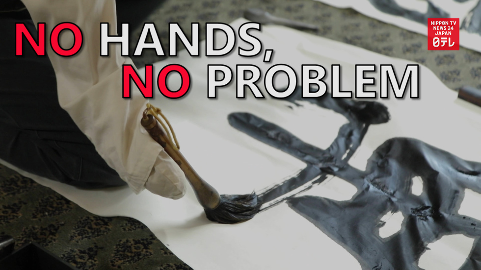 Handless calligrapher speaks with brush