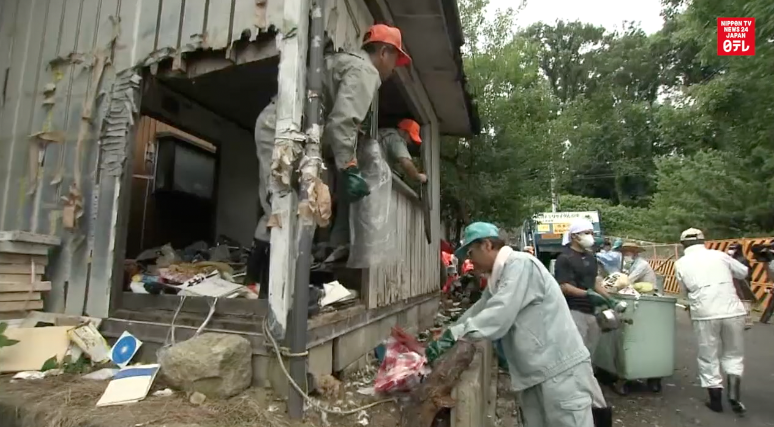 Hoarder's home gets clean-up