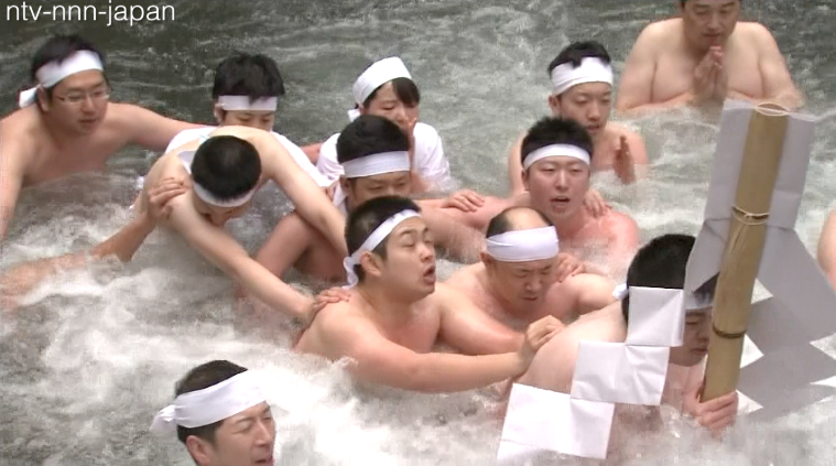 Shinto novices endure freezing waterfall