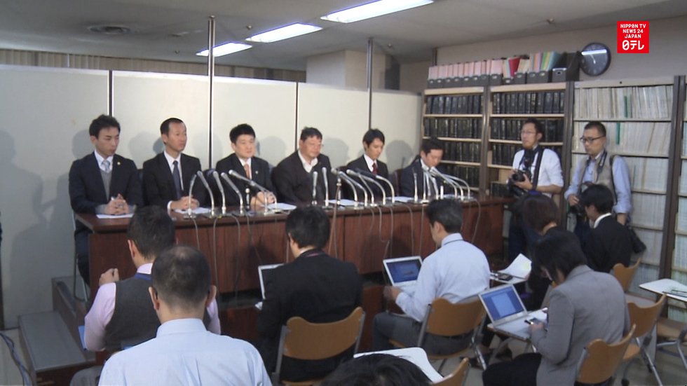 Toshiba faces fine and lawsuit