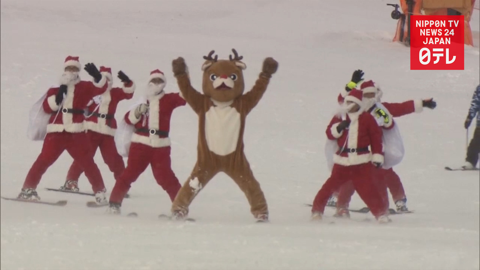 Skiing Santas bring Christmas fun
