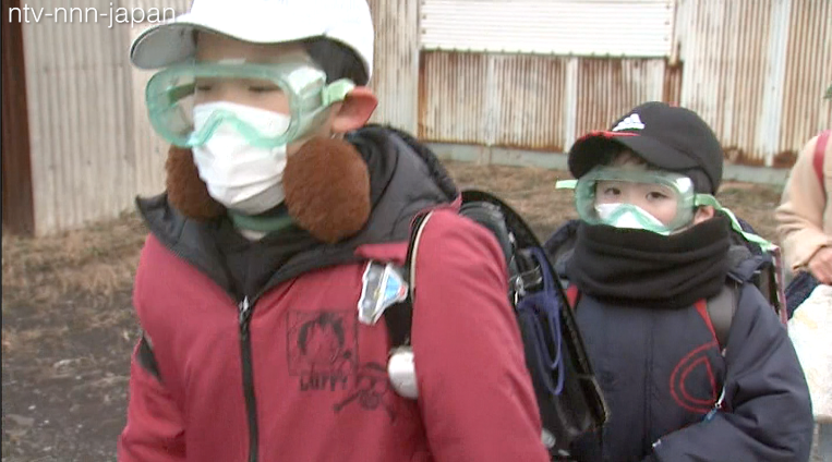 Students in goggles after volcano erupts